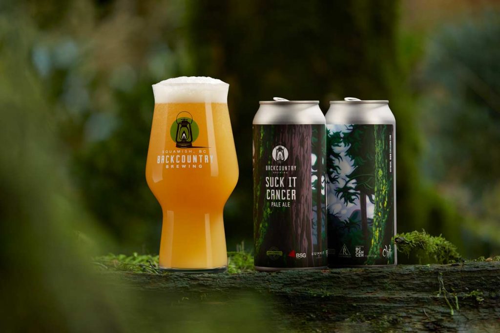 Backcountry Brewing | Cans of "Suck It Cancer" 2020 Release in a woodland setting - photo by Jordan Megahy