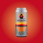 Back Country Brewing | Kinda Hot In These Rhinos | Corn Lager - Front of Can on background