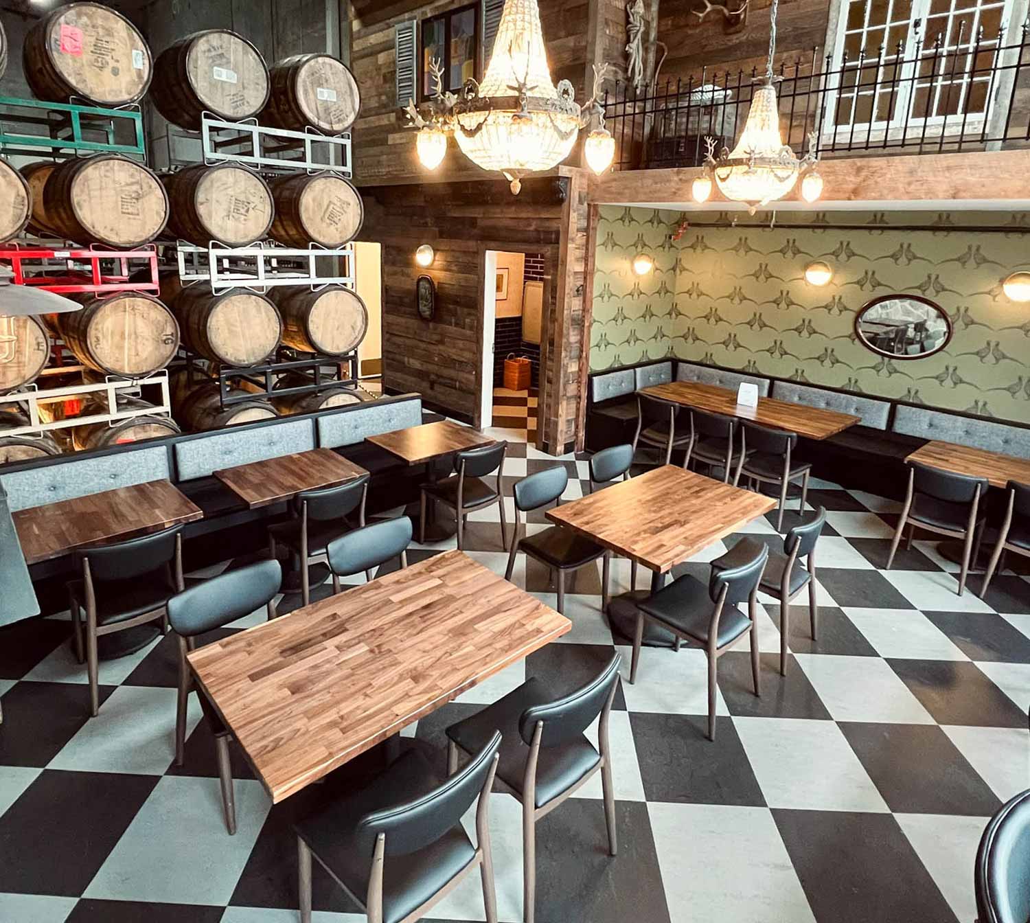 Backcountry Brewing - Barrel Lounge Room interior with tables and chairs